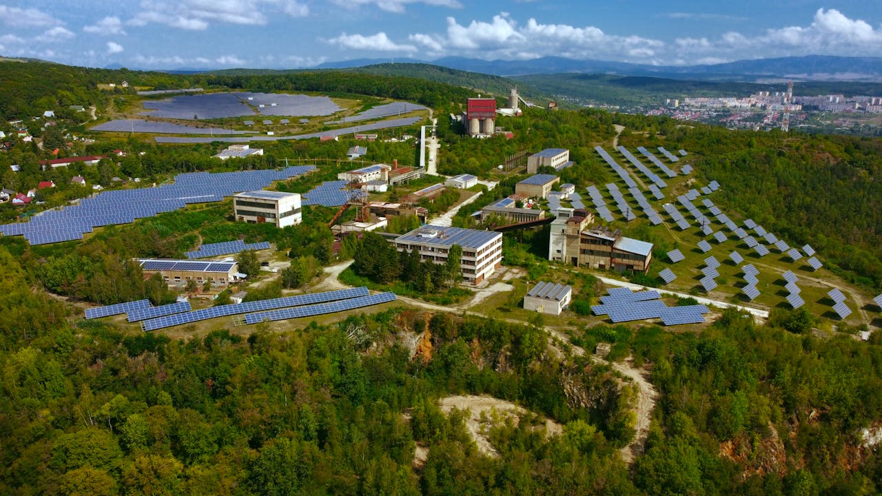 hero-img-01 Expansive aerial view of solar panels in Košice, showcasing modern renewable energy solutions.