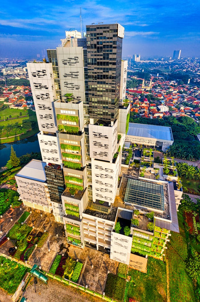 hero-img-02 Stunning drone shot capturing a contemporary building in Banten's urban landscape.